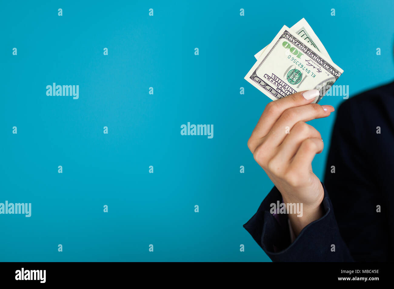 woman-holding-a-100-dollar-bill-stock-photo-alamy