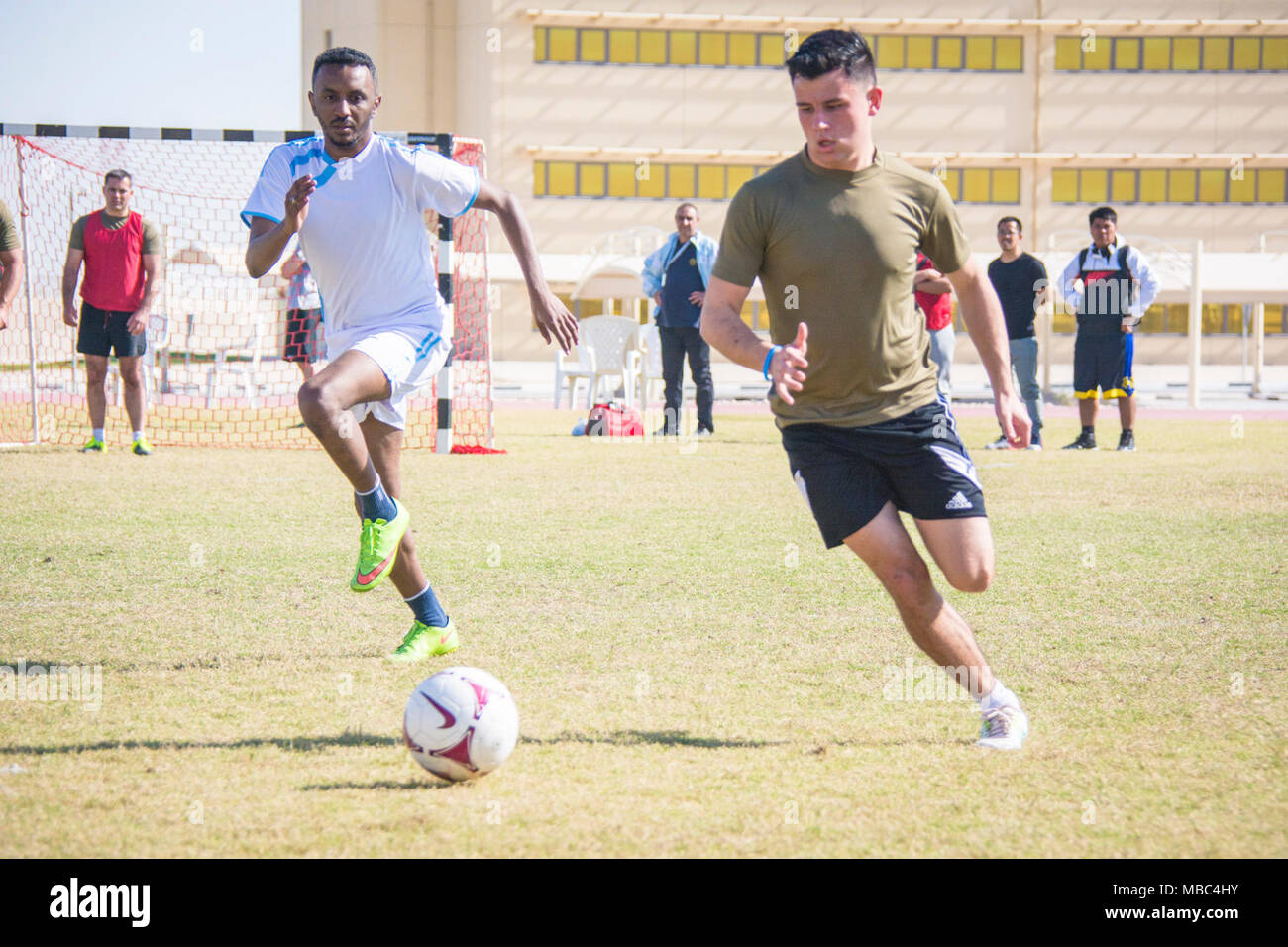 U.S. coalition partners play soccer during Qatar National Sports Day at Al Udeid Air Base, Qatar, Feb. 13, 2018. Competitors participated in several events throughout the day such as volleyball, soccer, basketball and track. The holiday began in 2011 after Emir Sheikh Tamim bin Hamad Al Thani instituted the holiday to promote a healthy and active lifestyle. (U.S. Air National Guard Stock Photo