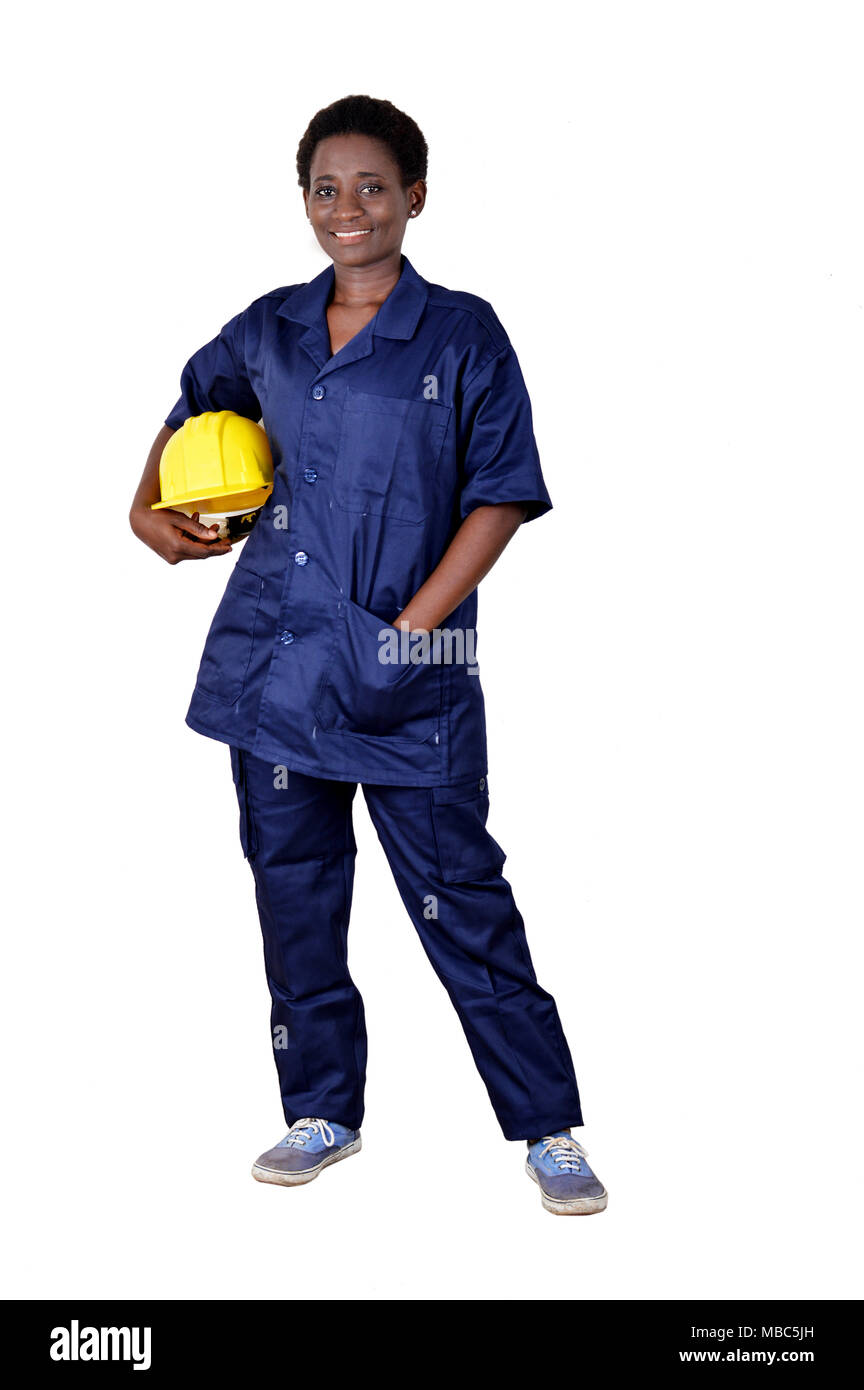 Young smiling construction worker holding his helmet on a white background. Stock Photo