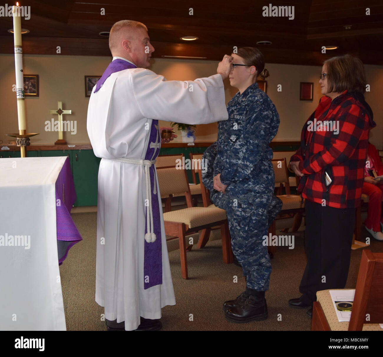 Cmdr. William Hlavin, Navy chaplain assigned to Naval Hospital  Bremerton (NHB) holds Ash Wednesday service and imposition of the ashes in  the command's chapel on Fe. 14, 2018. The observance began with a special  worship service followed by NHB chaplains taking the ashes throughout the  hospital and branch clinics to receive the imposition of ashes along with  prayer and a blessing in their work center Stock Photo