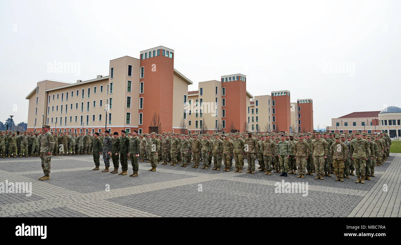 U.S. Army Paratroopers from 173rd Airborne Brigade, 2nd Cavalry Regiment from Vilsek, Germany, 1-4 Infantry from JMRC in Hohenfelds, Germany, Soldiers from Croatia, Spain, Poland, Italy and Slovenia stand in formation during the Expert Infantryman Badge (EIB) ceremony at Caserma Del Din, Vicenza, Italy, 15 Feb. 2018. (U.S. Army Stock Photo