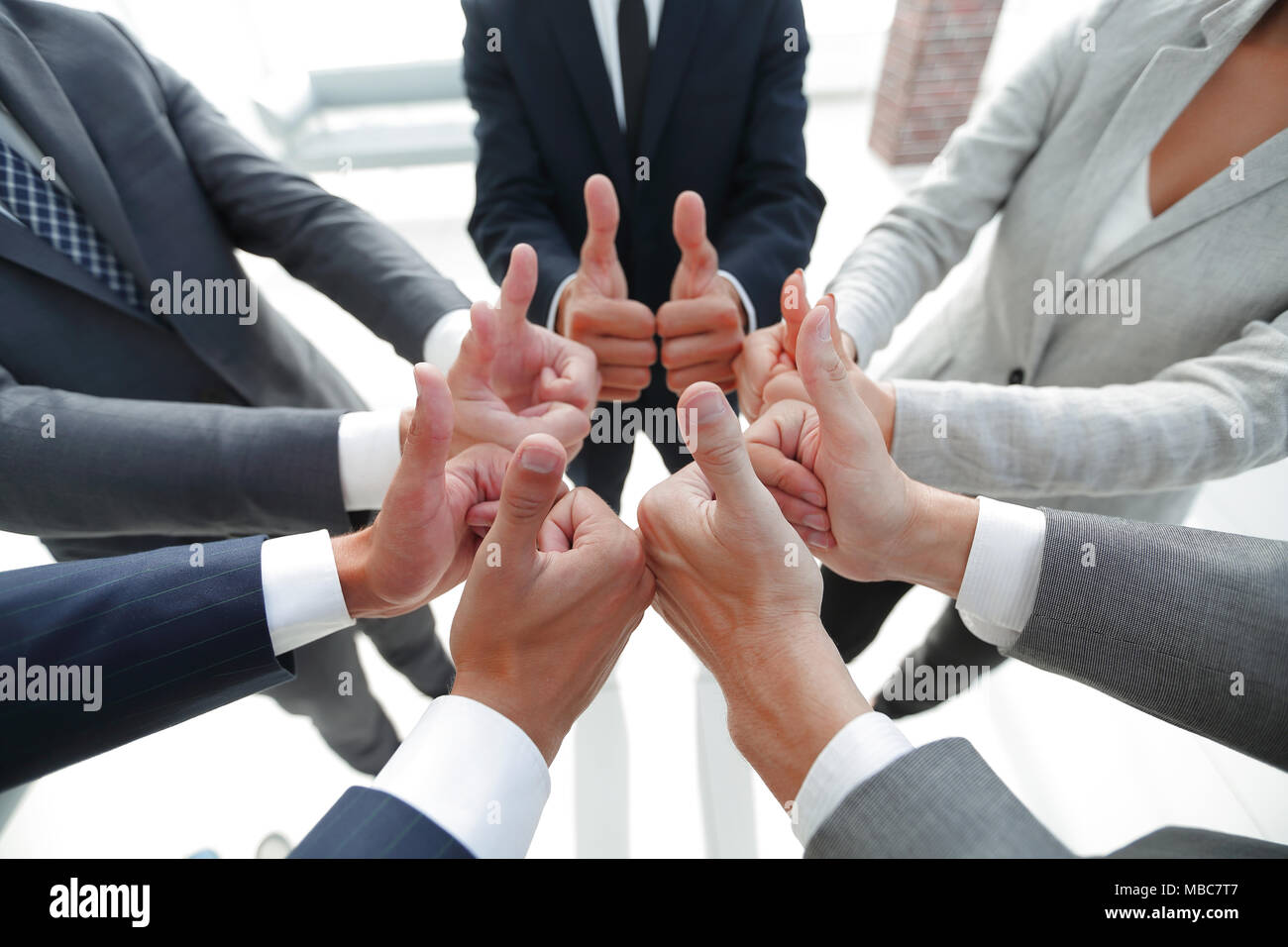 business team showing thumbs up Stock Photo - Alamy