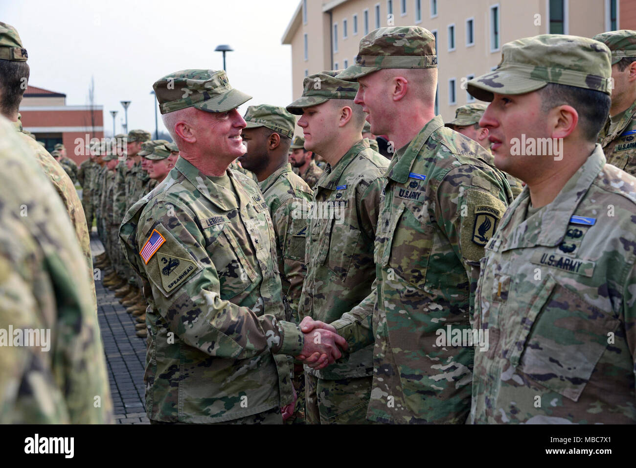 Brig. Gen. Eugene J. LeBoeuf, Commander, U.S. Army Africa (left), congratulates a U.S. Army Paratrooper assigned to the 173rd Airborne Brigade during the Expert Infantryman Badge (EIB) ceremony at Caserma Del Din, Vicenza, Italy, 15 Feb. 2018. (U.S. Army Stock Photo