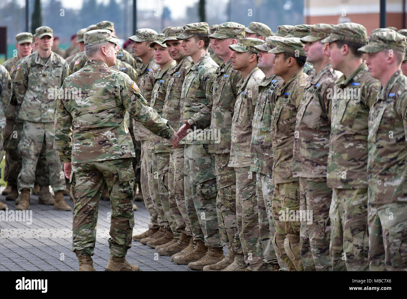 Command Sgt. Maj. Jeremiah E. Inman, CSM U.S. Army Africa, congratulates Paratroopers assigned to the 173rd Airborne Brigade during the Expert Infantryman Badge (EIB) ceremony at Caserma Del Din, Vicenza, Italy, 15 Feb. 2018. (U.S. Army Stock Photo