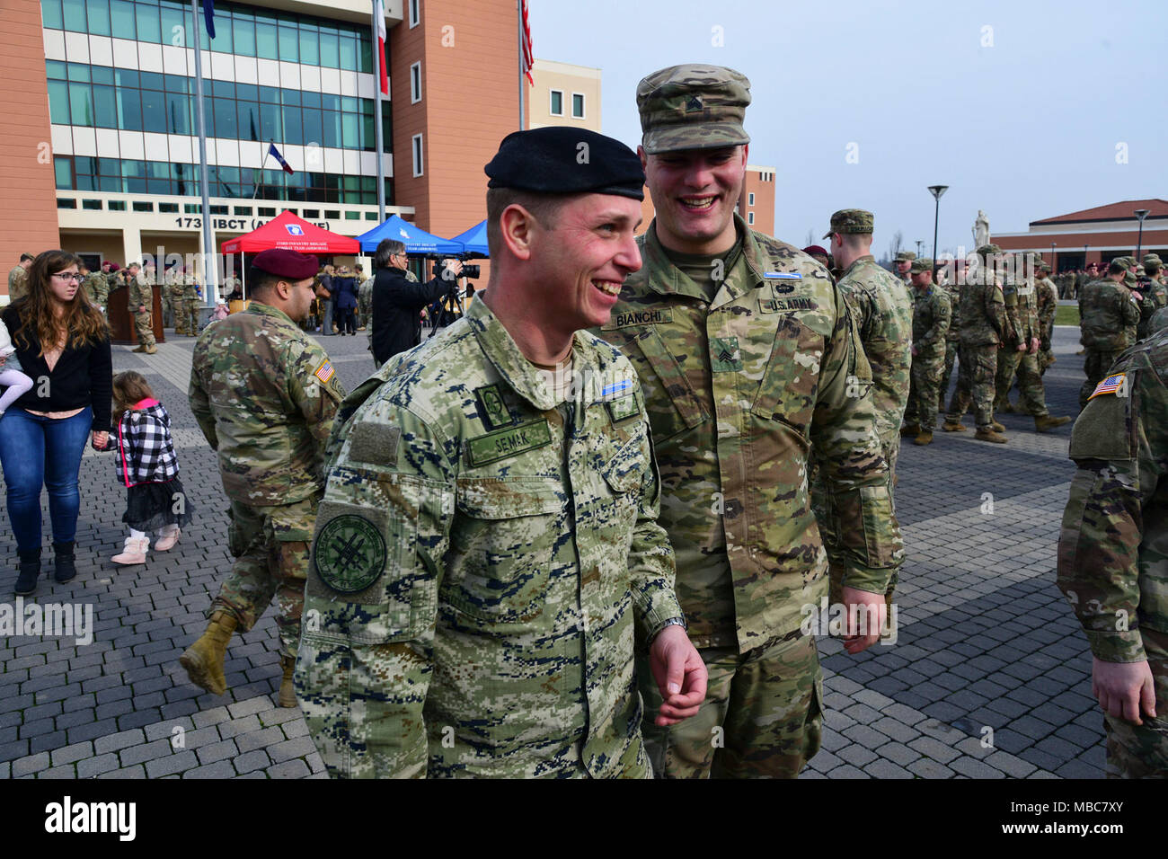 A U.S. Army Soldier and a Croatian Army Soldier share camaraderie during the Expert Infantryman Badge (EIB) ceremony at Caserma Del Din, Vicenza, Italy, 15 Feb. 2018. (U.S. Army Stock Photo