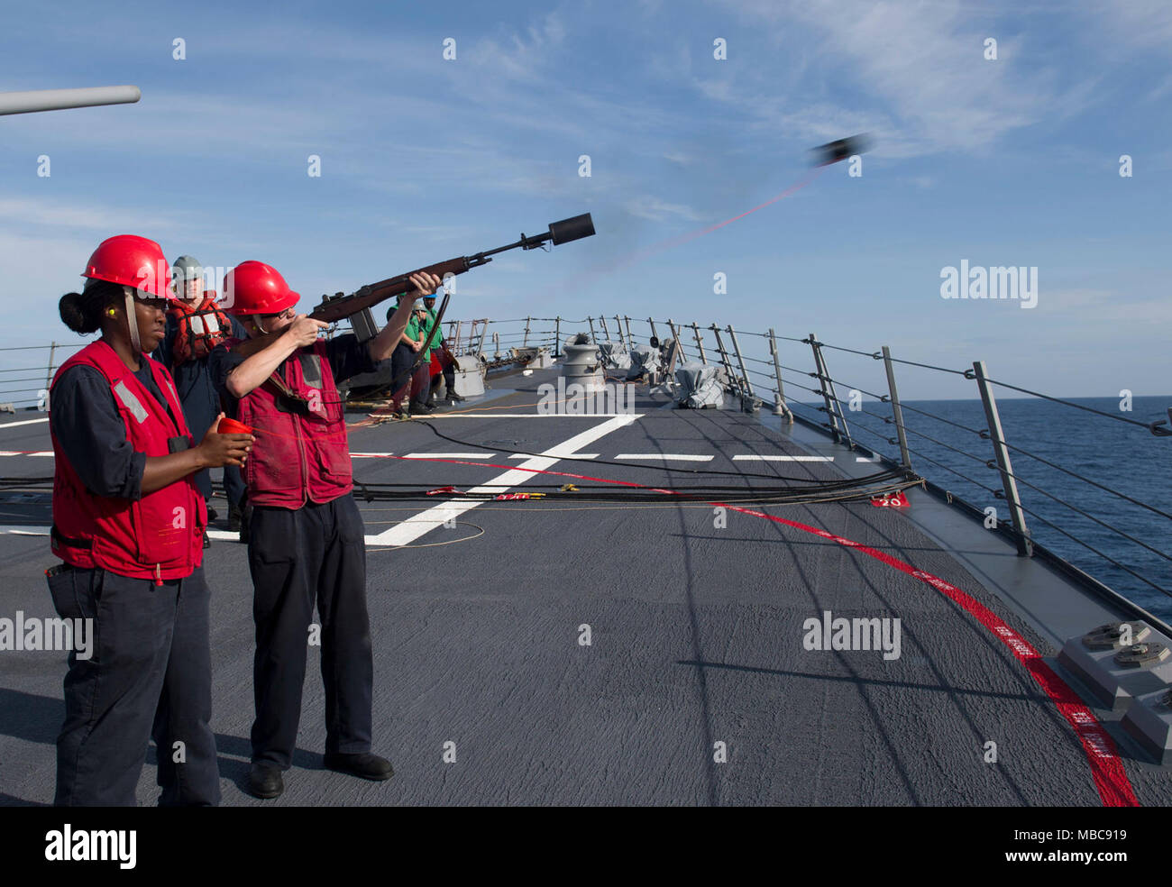 SOUTH CHINA SEA (Feb. 15, 2018) Gunner’s Mate 3rd Class Ryan Buck fires ...