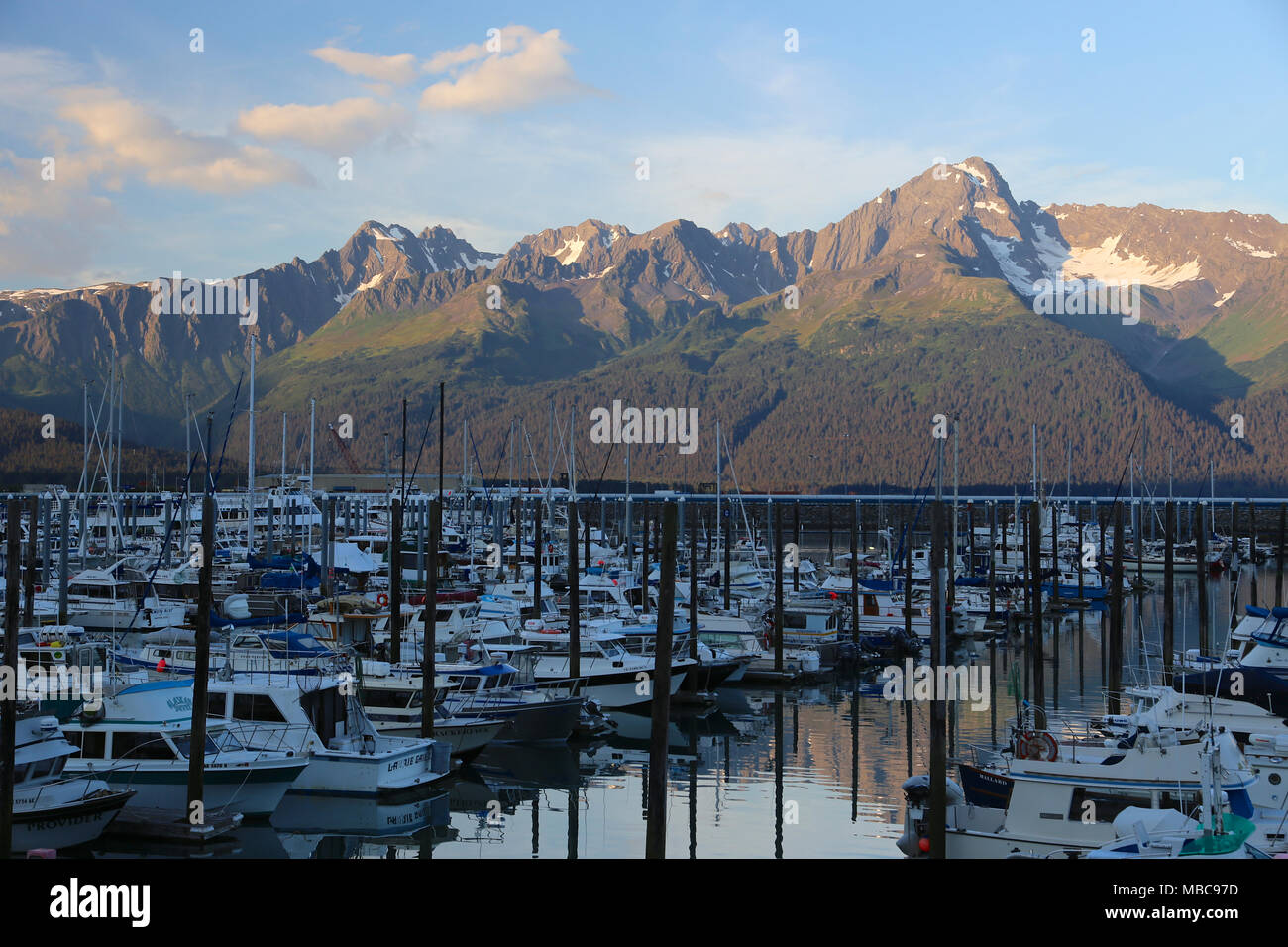 Boats in harbor and marina in the coastal Alaska mountain town of Seward Stock Photo