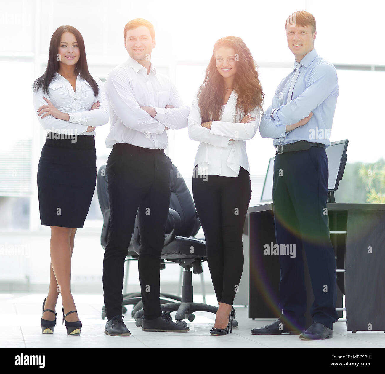 professional business team standing near the desktop Stock Photo - Alamy