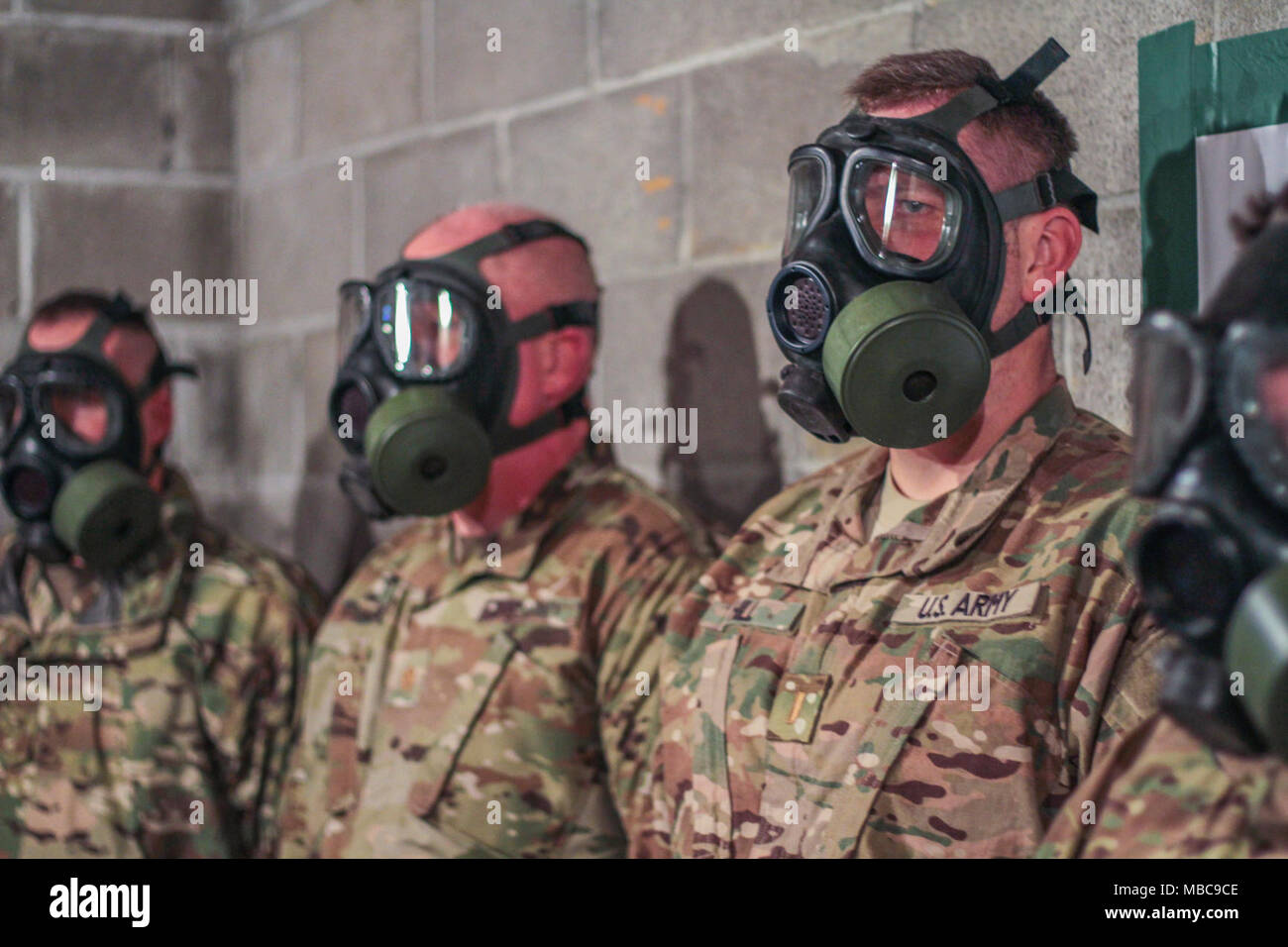 Guardsmen assigned to 155th Armored Brigade Combat Team, participate in a chemical protective mask confidence exercise at Camp Shelby Joint Forces Training Center, Miss., Feb. 15, 2018.  The 155th ABCT is preparing for an upcoming deployment to the Middle East in support of Operation Spartan Shield. (U.S. Army National Guard Stock Photo