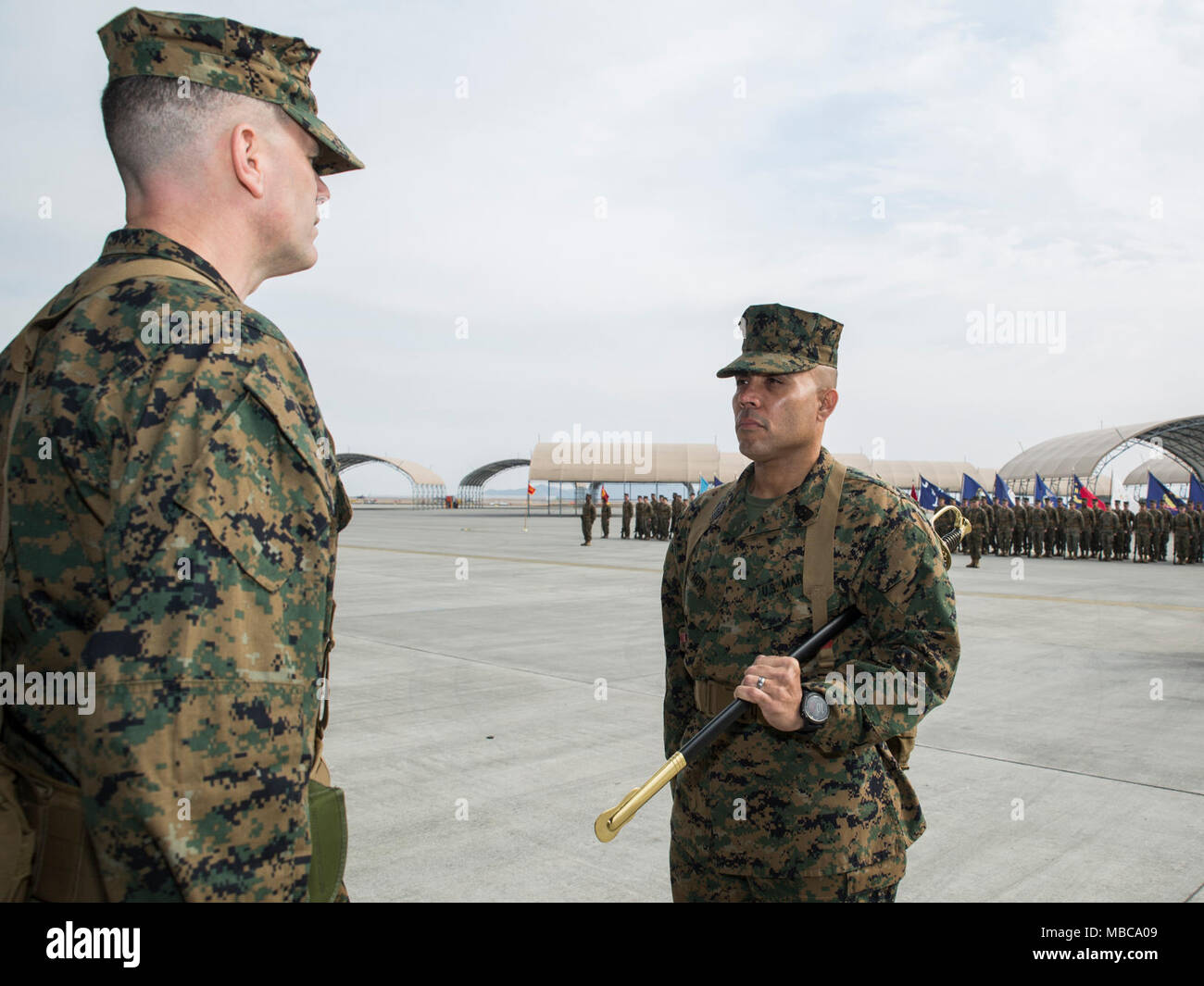 U.S. Marine Corps Sgt. Maj. Edwin Mota, outbound sergeant major for Marine Aviation Logistics Squadron (MALS) 12, prepares to relinquish the sword of office to Lt. Col. John Fallow, commanding officer for MALS-12, during a relief ceremony at Marine Corps Air Station Iwakuni, Japan, Feb. 16, 2018. The ceremony symbolized the end of Mota’s role as MALS-12 sergeant major. He is slated to report to Okinawa, where he will be appointed as the sergeant major for the 31st Marine Expeditionary Unit. (U.S. Marine Corps Stock Photo