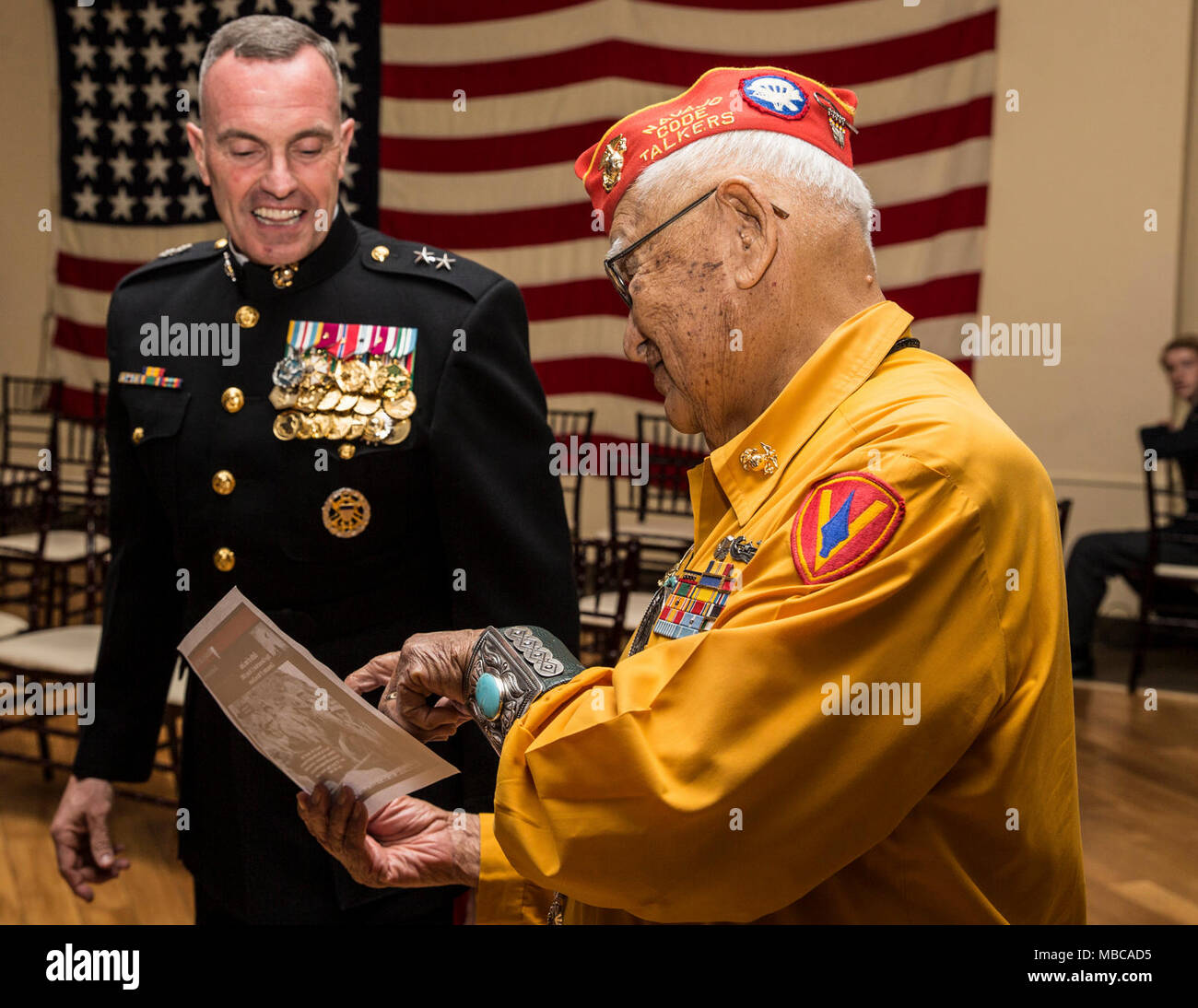Thomas H Begay, Navajo Code Talker and survivor of the Battle of Iwo Jima, speaks with Maj. Gen. Vincent Coglianese at the 73rd Anniversary of the Battle of Iwo Jima celebration on Marine Corps Base Camp Pendleton, Calif., February 17, 2018. The evening included a sunset memorial, 21-gun salute and banquet. (U.S. Marine Corps Stock Photo