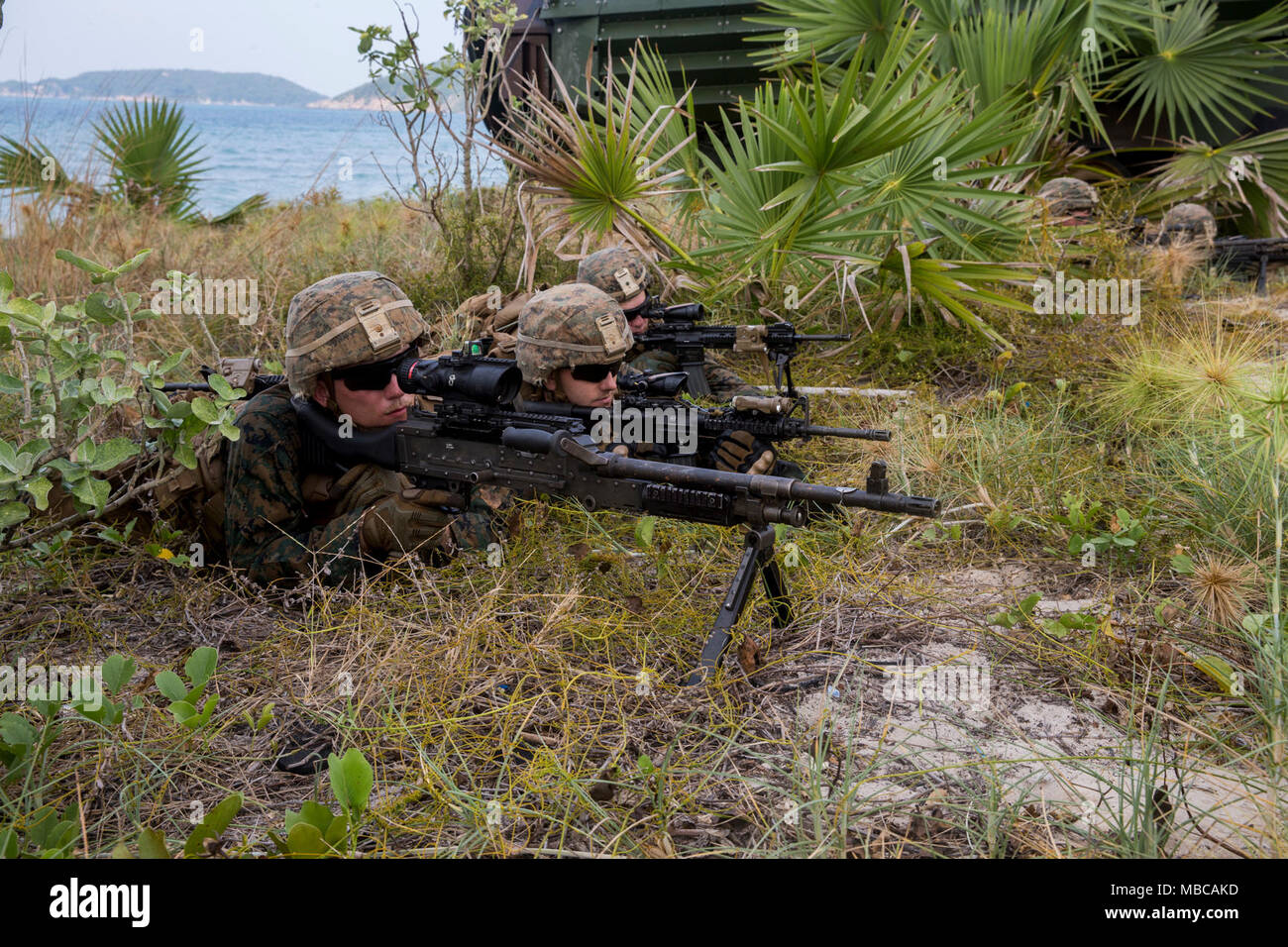 U.S. Marines with Kilo Company, 3rd Battalion, 3rd Marine Regiment, 3rd Marine Division post security during amphibious operations for Exercise Cobra Gold 2018, in the Kingdom of Thailand, Feb. 17, 2018. Cobra Gold 18 is an annual exercise conducted in the Kingdom of Thailand from Feb. 13-23 with seven full participating nations. The Hawaii-based battalion is forward-deployed to Okinawa, Japan part of the unit deployment program. (U.S. Marine Corps Stock Photo