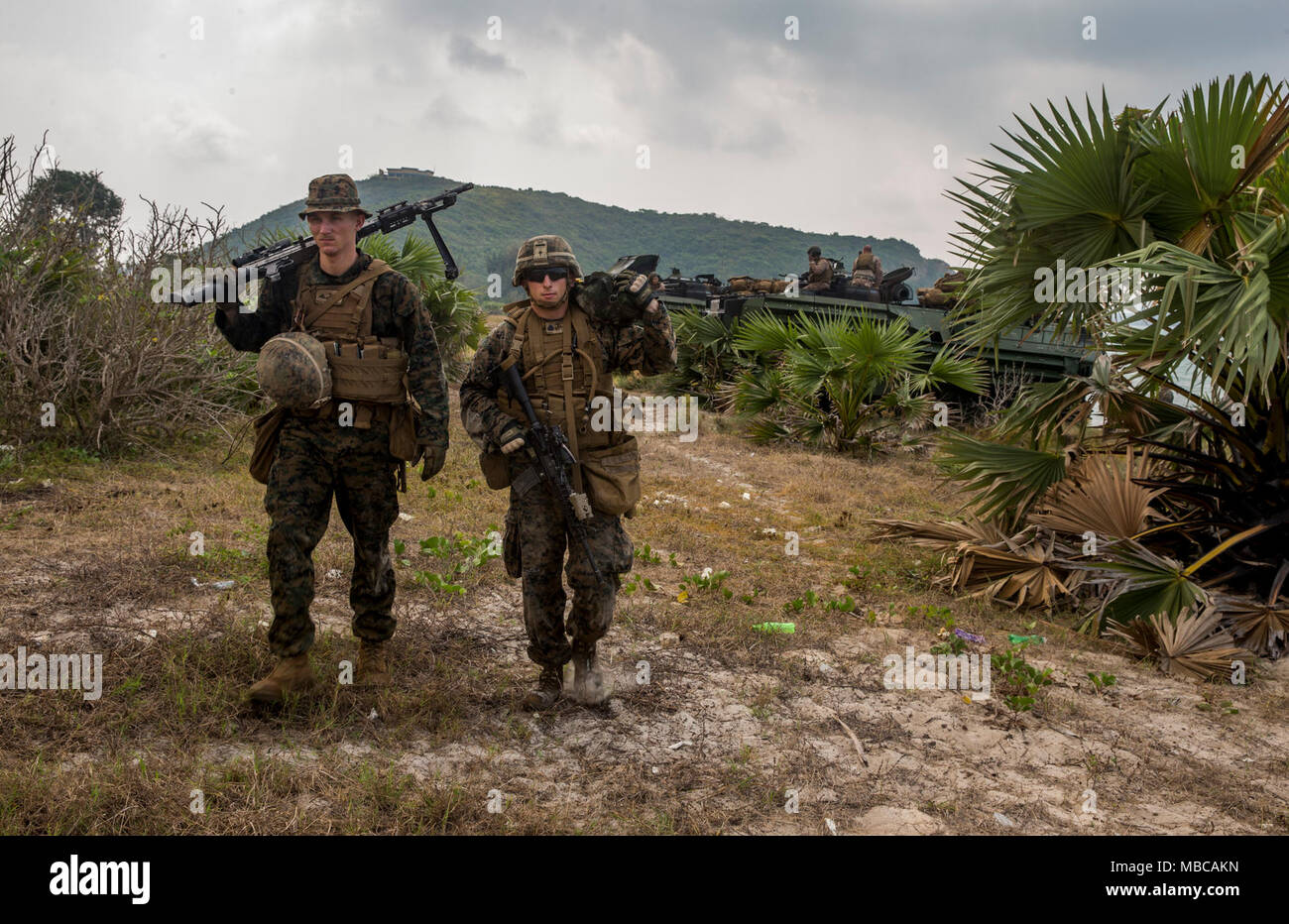 U.S. Marines with Kilo Company, 3rd Battalion, 3rd Marine Regiment, 3rd Marine walk on the beach after the index of amphibious operations during Exercise Cobra Gold 2018, in the Kingdom of Thailand, Feb. 17, 2018. Cobra Gold 18 is an annual exercise conducted in the Kingdom of Thailand from Feb. 13-23 with seven full participating nations. The Hawaii-based battalion is forward-deployed to Okinawa, Japan part of the unit deployment program. (U.S. Marine Corps Stock Photo