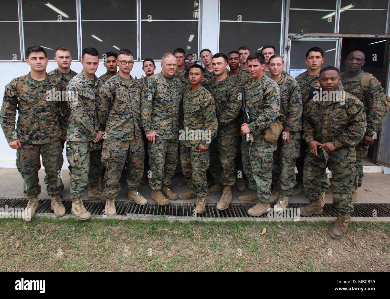 Commandant of the Marine Corps Gen. Robert B. Neller and Sergeant Major of the Marine Corps Sgt. Maj. Ronald L. Green pose for a photo with Marines during a visit to Ban Chan Khrem, Thailand, Feb. 18, 2018. Neller addressed the Marines about his latest Message to the Force: Execute and answered questions. (U.S. Marine Corps Stock Photo