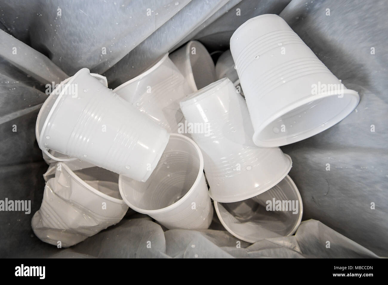 Used disposable drinking cups in a waste bin. While NHS trusts across the country opened up about the scale of disposable cup use, Government departments were less forthcoming. Stock Photo