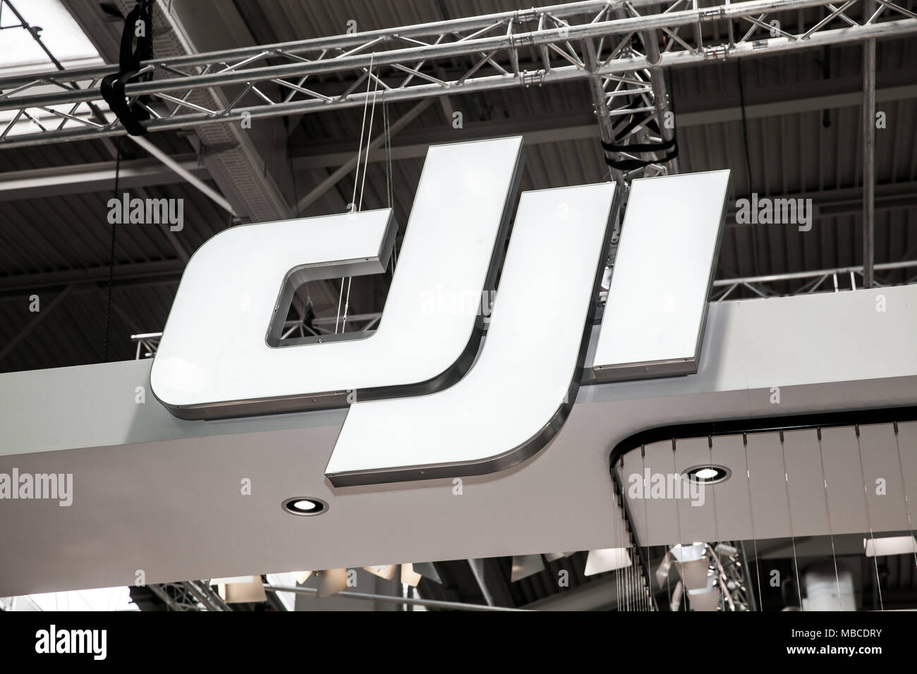 DJI company logo sign on exhibition fair Cebit 2017 in Hannover Messe, Germany Stock Photo