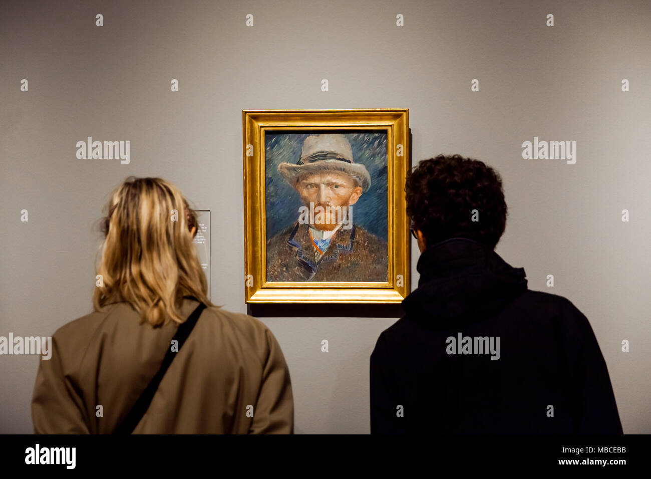 Visitors watching self-portrait artwork of famous painter Vincent van Gogh in Rijsmuseum in Amsterdam city, Holland Stock Photo