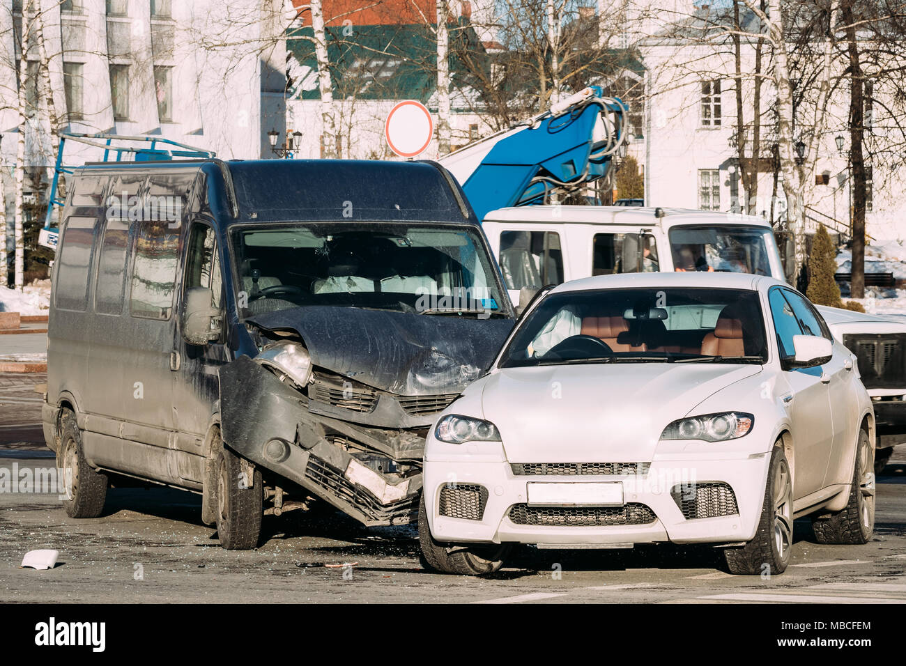Collision Of Two Cars. Crashed Minibus And Luxury Crossover SUV Cars In City Street. Car Wreck, Accident Stock Photo