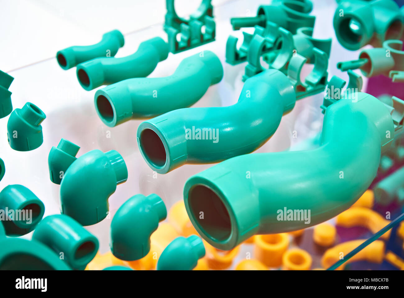 Green plastic fittings for the plumbing system Stock Photo Alamy