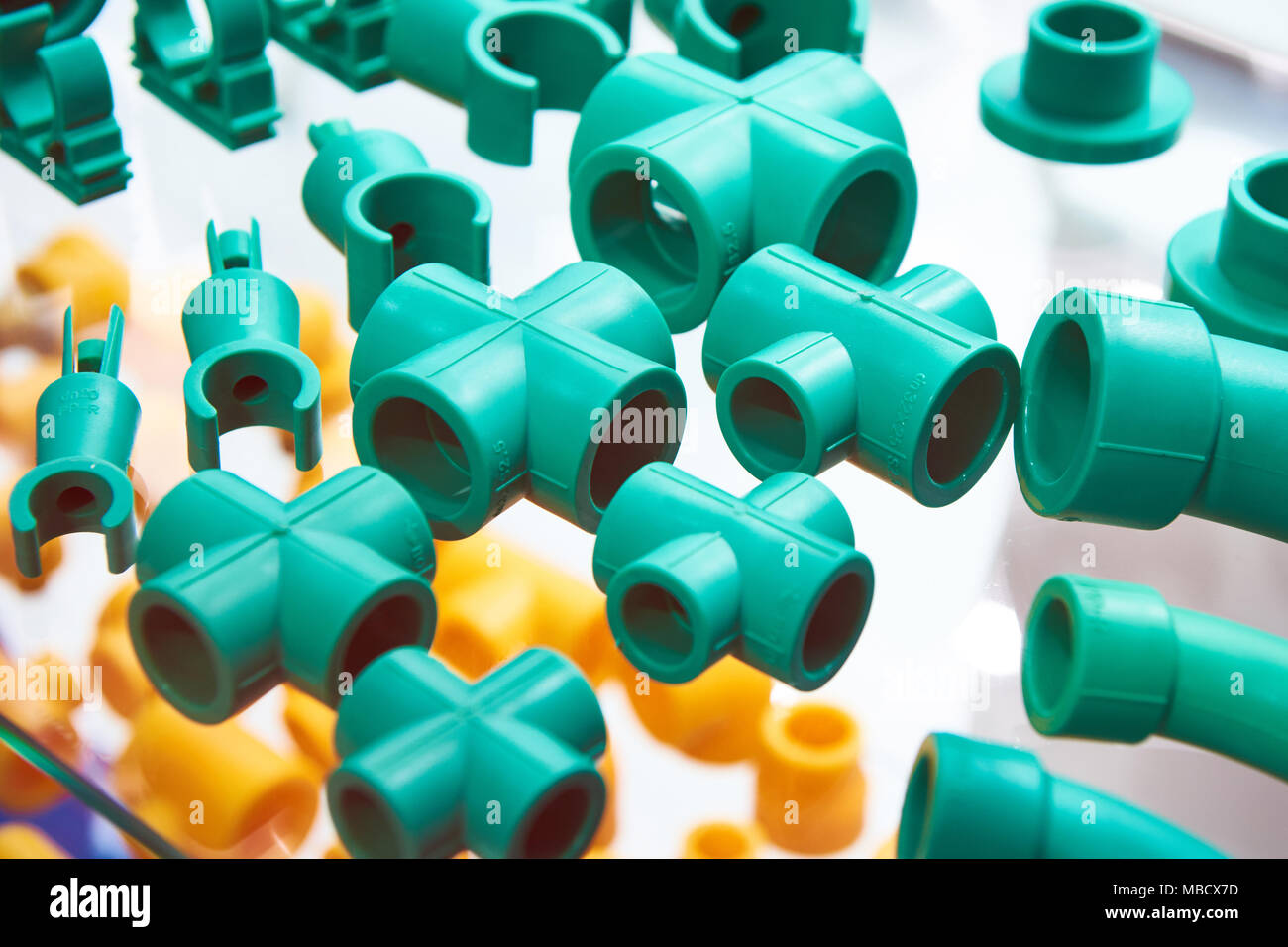 Green plastic fittings for the plumbing system Stock Photo Alamy