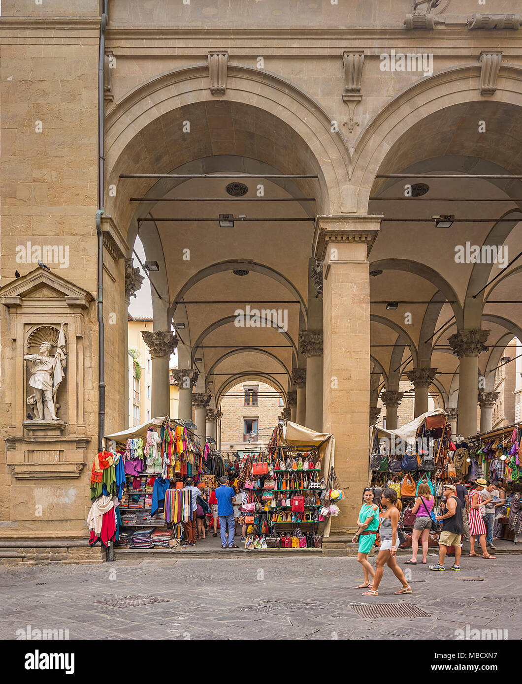 Florence, Italy, June 2015: tourists and Florentines walking and shopping in the historic Mercato del Porcellino (pig market) in the center of Florenc Stock Photo