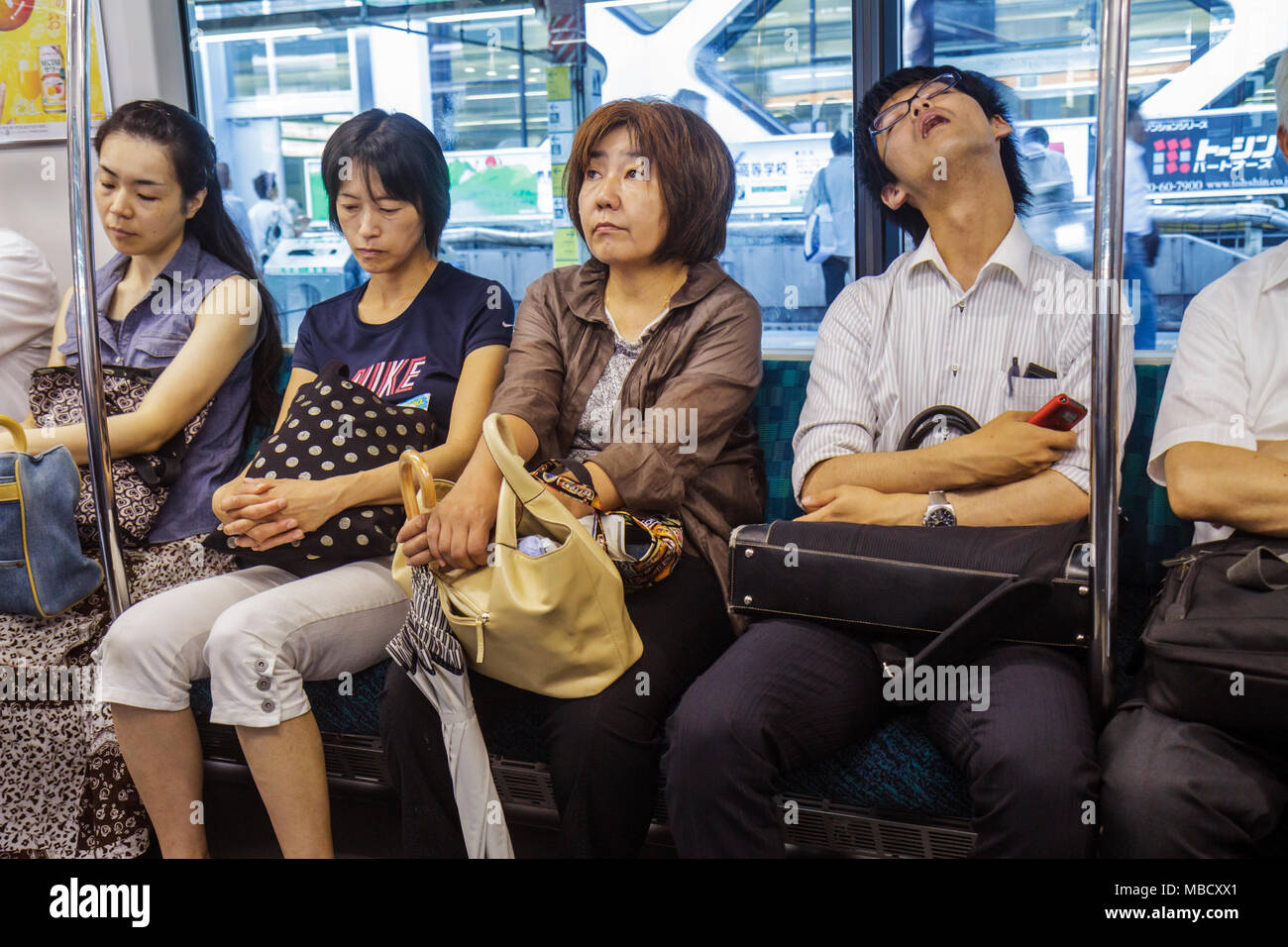 Tokyo Japan,Shinjuku,JR Shinjuku Station,train,subway,train,train,Yamanote Line,Asian woman female women adult adults,man men male,men,salaryman,noddi Stock Photo