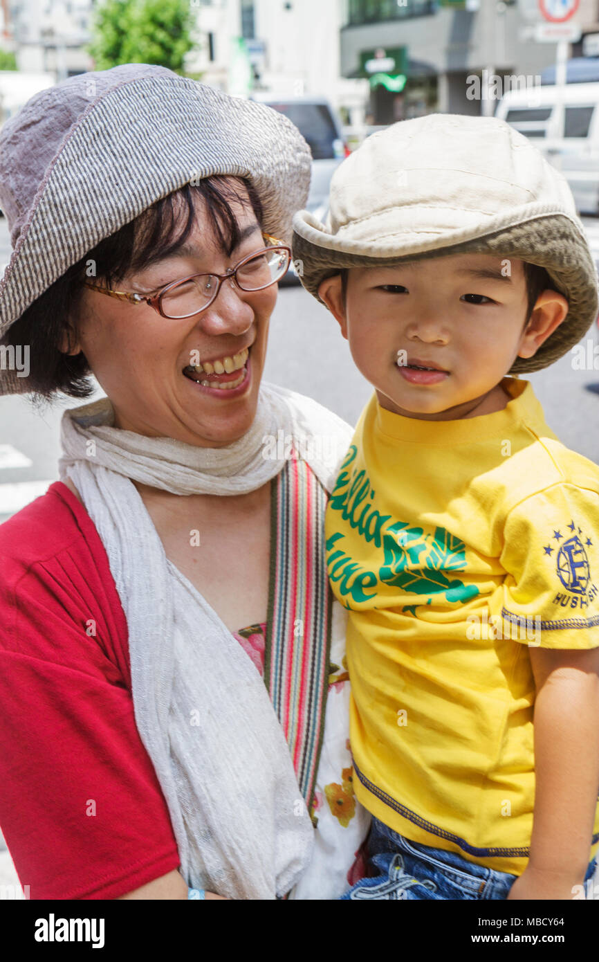 Tokyo Japan,Ryogoku,Asian Oriental,mother,parent,parents,woman female women adult adults,boy boys,male kid kids child children youngster,son,hats,fami Stock Photo