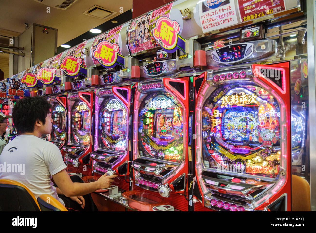 Tokyo Japan,Ryogoku,kanji,pachinko parlor,gamble,gambling,prizes,vertical pinball machine,Asian Oriental,man men male adult adults,playing,Japanese,Or Stock Photo