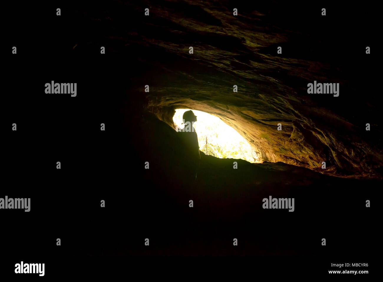 woman standing in Rawana Ella cave in Sri lanka. Stock Photo