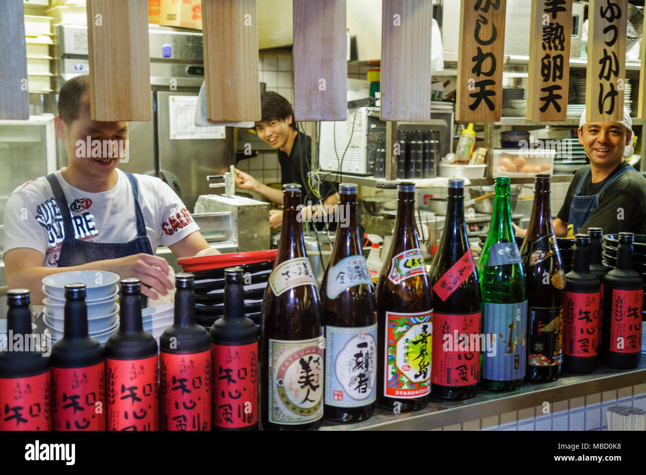 Tokyo Japan,Akihabara,Asian Oriental,man men male adult adults,workers,restaurant restaurants food dining cafe cafes,kitchen,cook,kanji,Japanese Engli Stock Photo