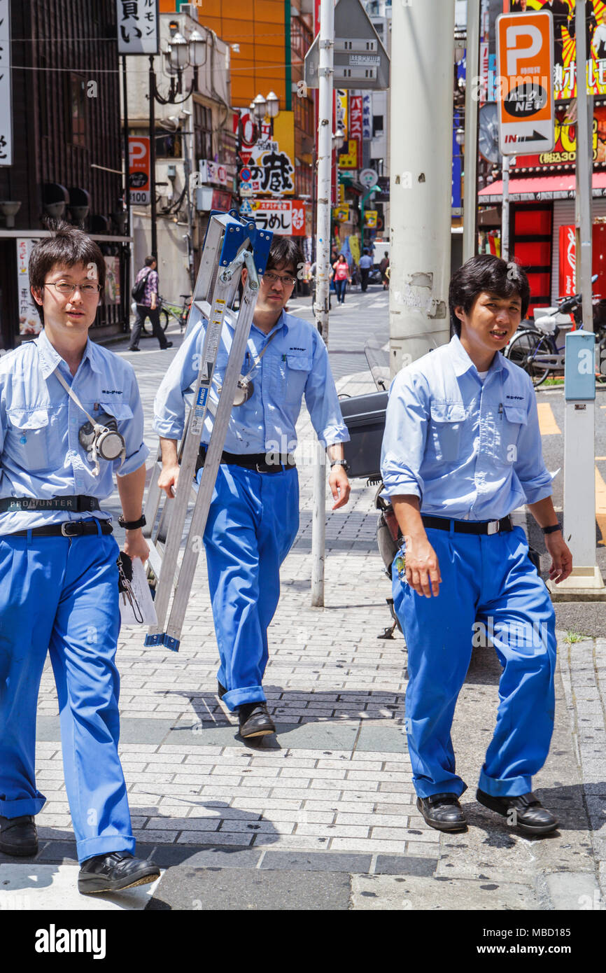 Tokyo Japan,Ikebukuro,Asian Oriental,man men male adult adults,workers,uniform,ladder,maintenance,working,work,employee worker workers staff,Japanese, Stock Photo