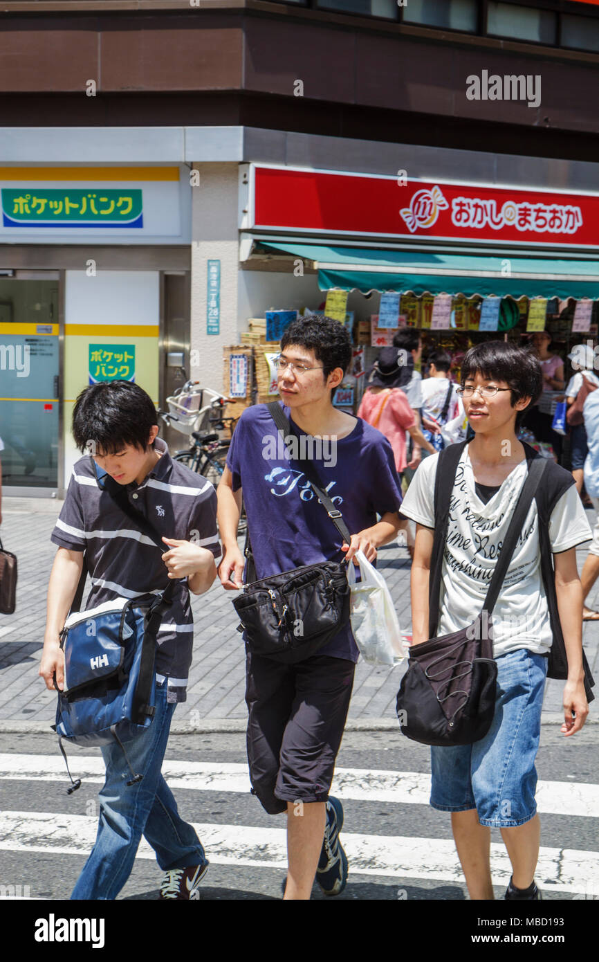 Tokyo Japan,Asia,Orient,Ikebukuro,Asian Asians ethnic immigrant immigrants minority,Oriental,teen teens teenage teenager teenagers youth adolescent,ad Stock Photo