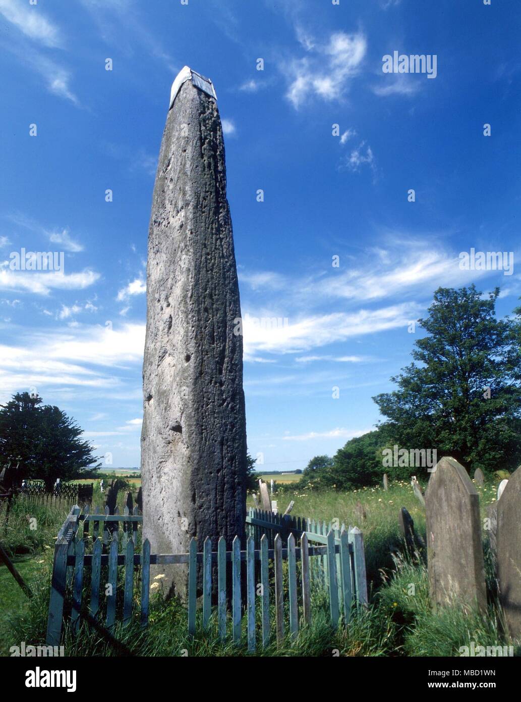 Strones - Rudstone Monolith. The highest monolithic standing stone in Britain, in Rudstone churchyard (Humberside), towers 25 feet from the ground. It is said to weigh over 40 tons. The Devil is said to have flung the stone at the church and missed Stock Photo