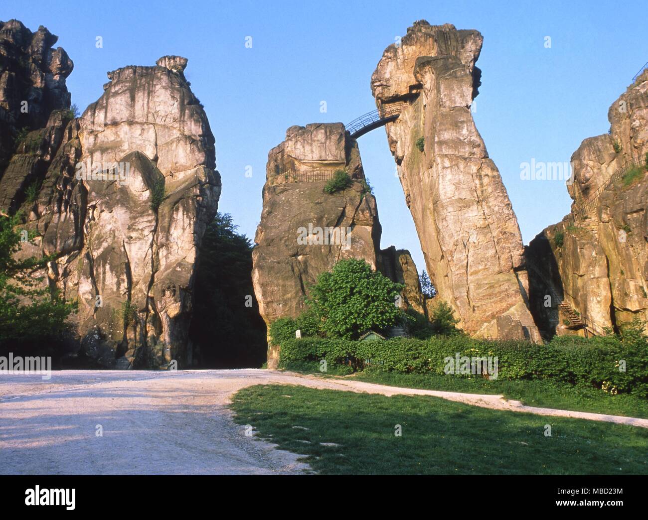 Externsteine rocks, Detmold, Germany. The relief image of a large headed hanging man on the left hand rock is said to represent Odin hanging Stock Photo