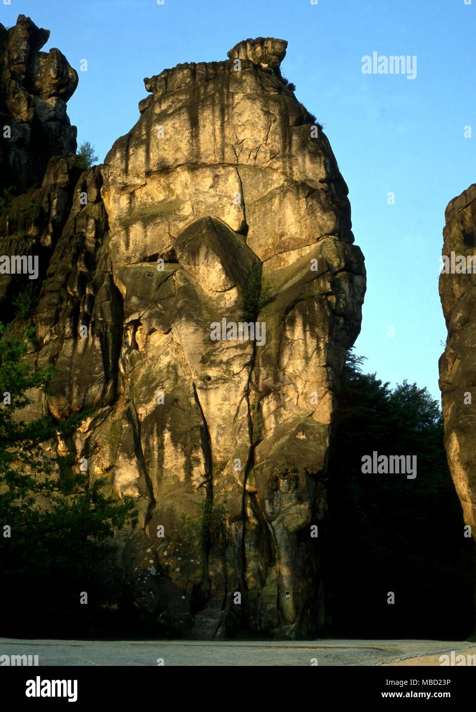 Image of the hanging Odin enduring tortune on the cross to learn the secret of the runes Externsteine rocks, Detmold, Germany. Stock Photo