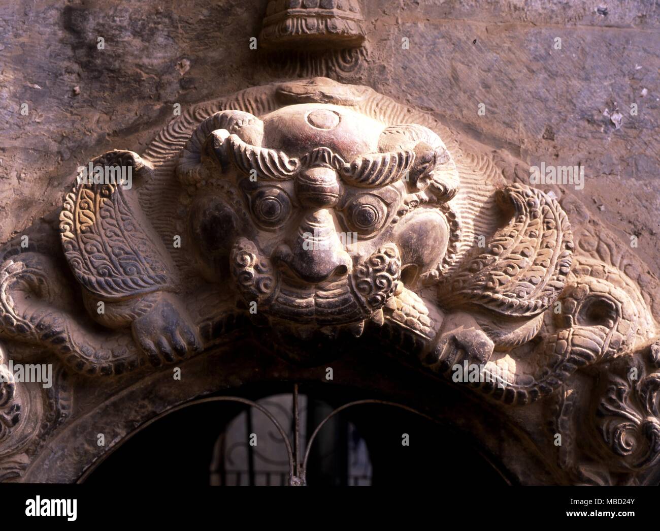 Tibetan Mythology. The head of Kirtimukha (Face of Glory) which is found above the portals of Shaivite temples, espcially in Kathmandu Stock Photo