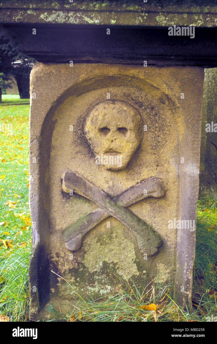 Symbols Skull and Crossbones on a tombstone in Eyam graveyard Stock