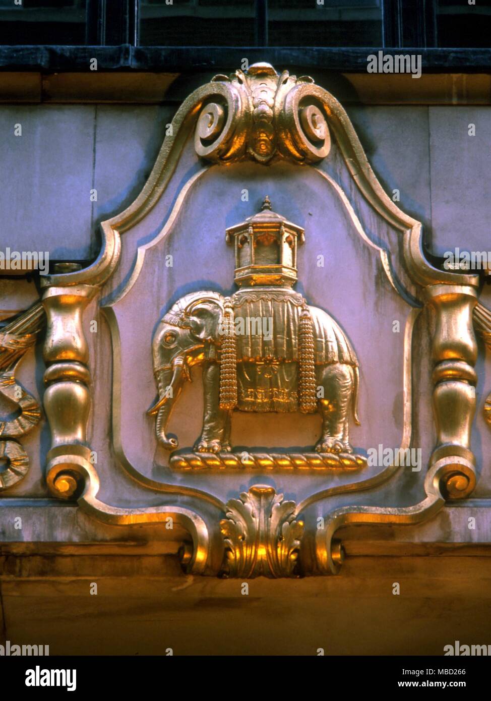 Elephant as symbol on the facade of a building which once served the Indian trade company, in the East End of London. Stock Photo