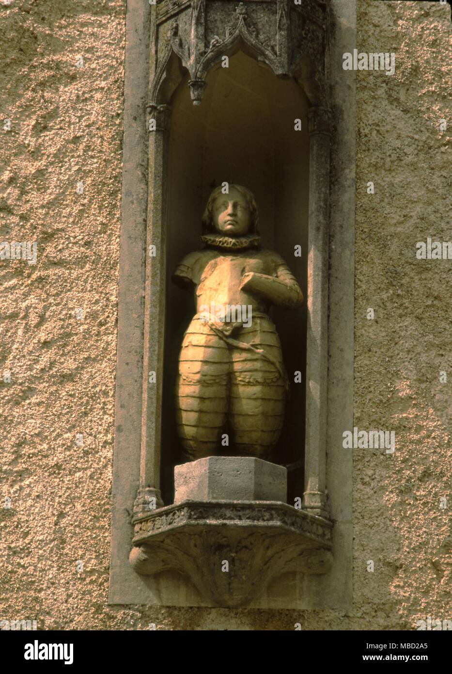 Statue of Joan of Arc. The figure is set in a niche on the front of the house at Domremy, where she is supposed to have been born. Stock Photo