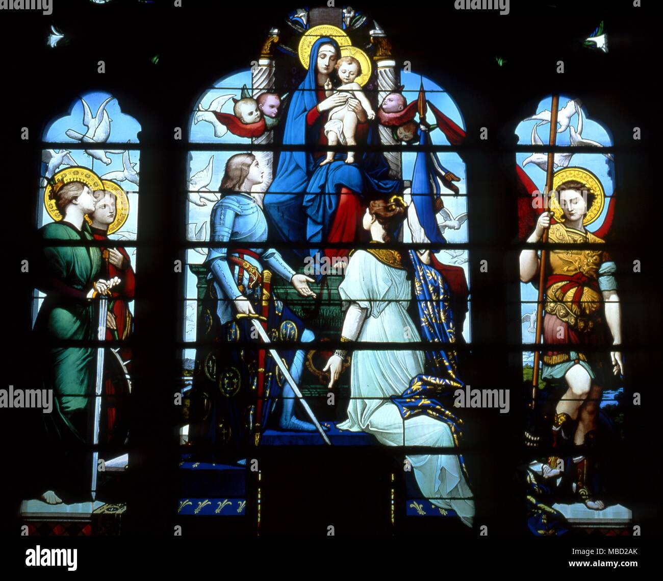 Joan of Arc before the Virgin. Stained glass window in the Basilique du