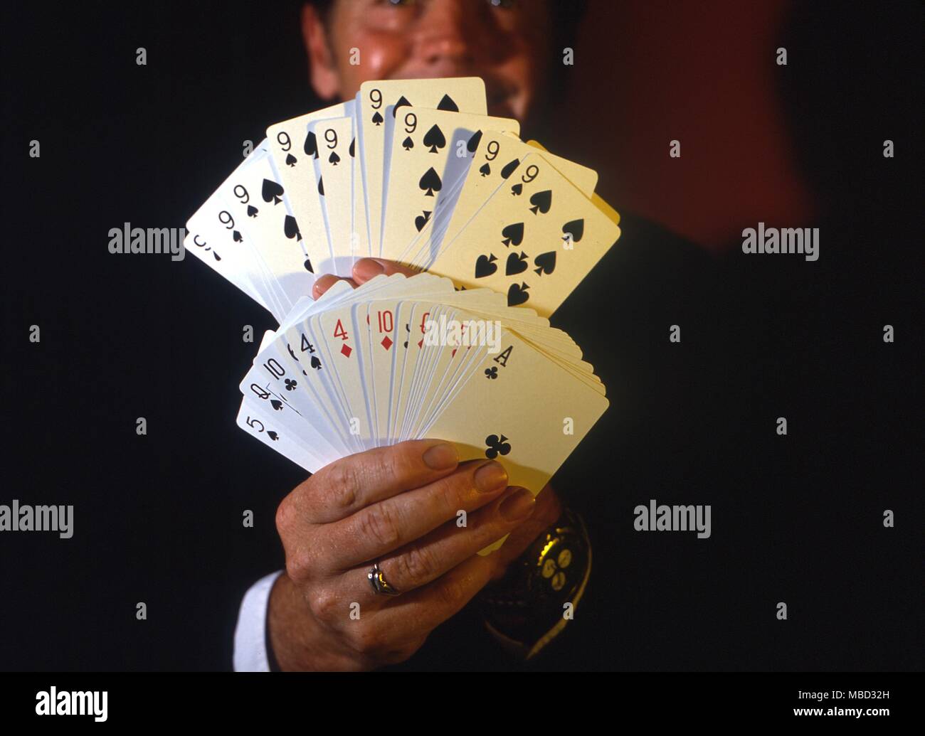 Stage Magic Card Tricks Magician fanning decks of cards for the