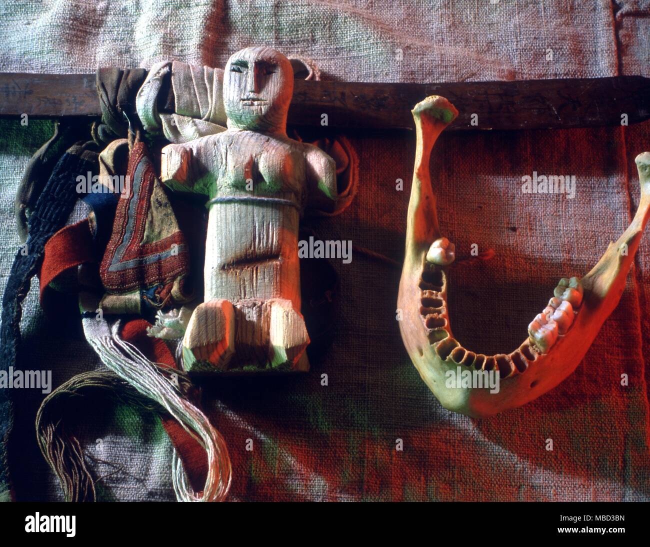 Collection of shaman's ritual objects from Laos and Siberia, including a skull and human jawbone. Stock Photo