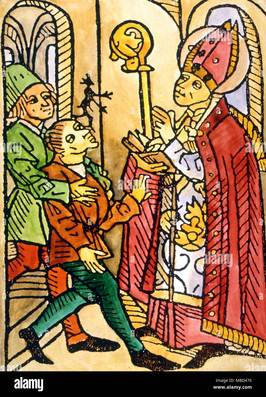 Exorcism - The devil being exorcised from the mouth of one of his victims by a bishop. A 15th century woodcut, from CJS Thompson's The Mysteries and Secrets of Magic 1917. - ©Charles Walker / Stock Photo