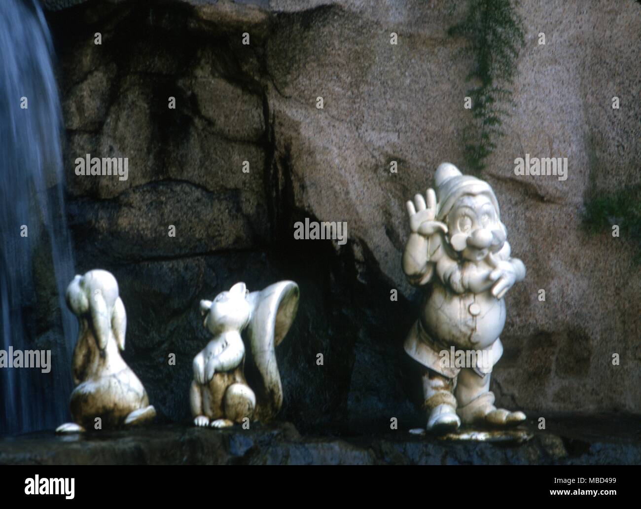 Elementals - Gnomes - The gnomes (dwarfs) of the story Snow White and the Seven Dwarfs near the wishing well in Disneyworld, California. - ©Charles Walker / Stock Photo
