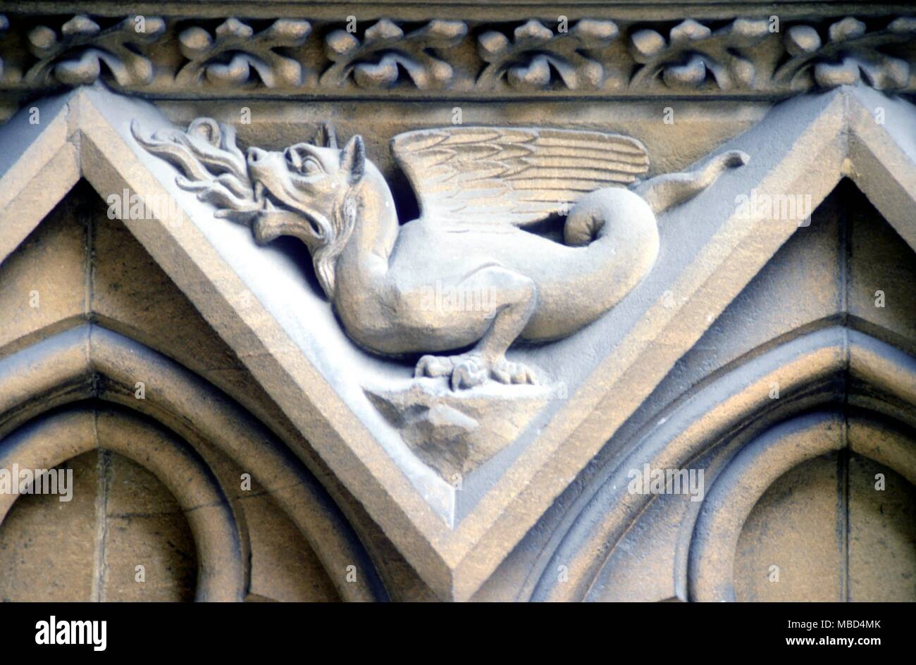 Dragon in the porch of Metz Cathedral - part of a symbolic cycle of the elements, in which the dragon represents the element fire. Thirteenth century (restored). © / Charles Walker Stock Photo