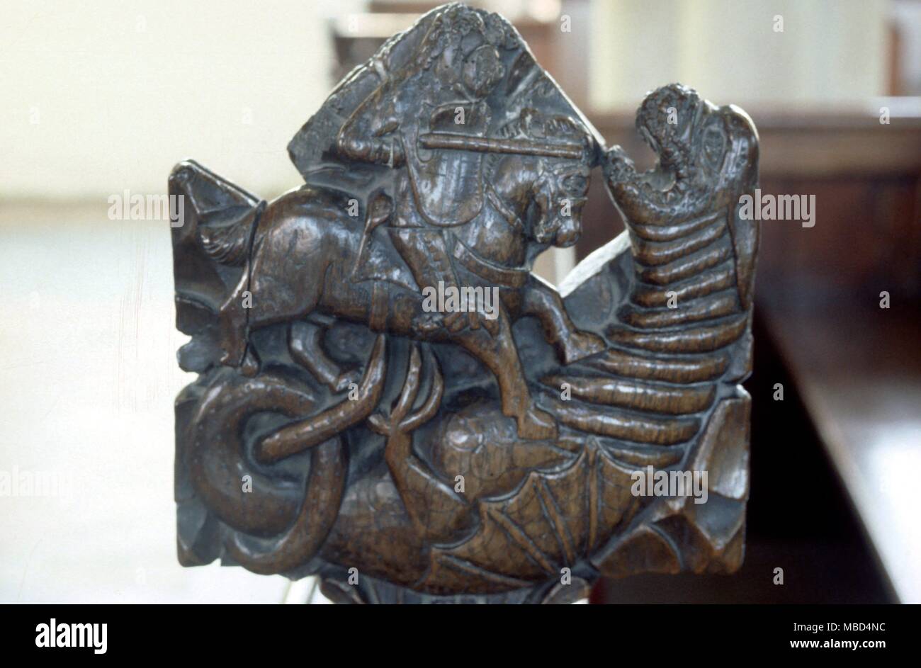 Poppyhead Dragon - St. George and the dragon on a poppyhead is Withersfield parish church. 16th century (?) © / Charles Walker Stock Photo