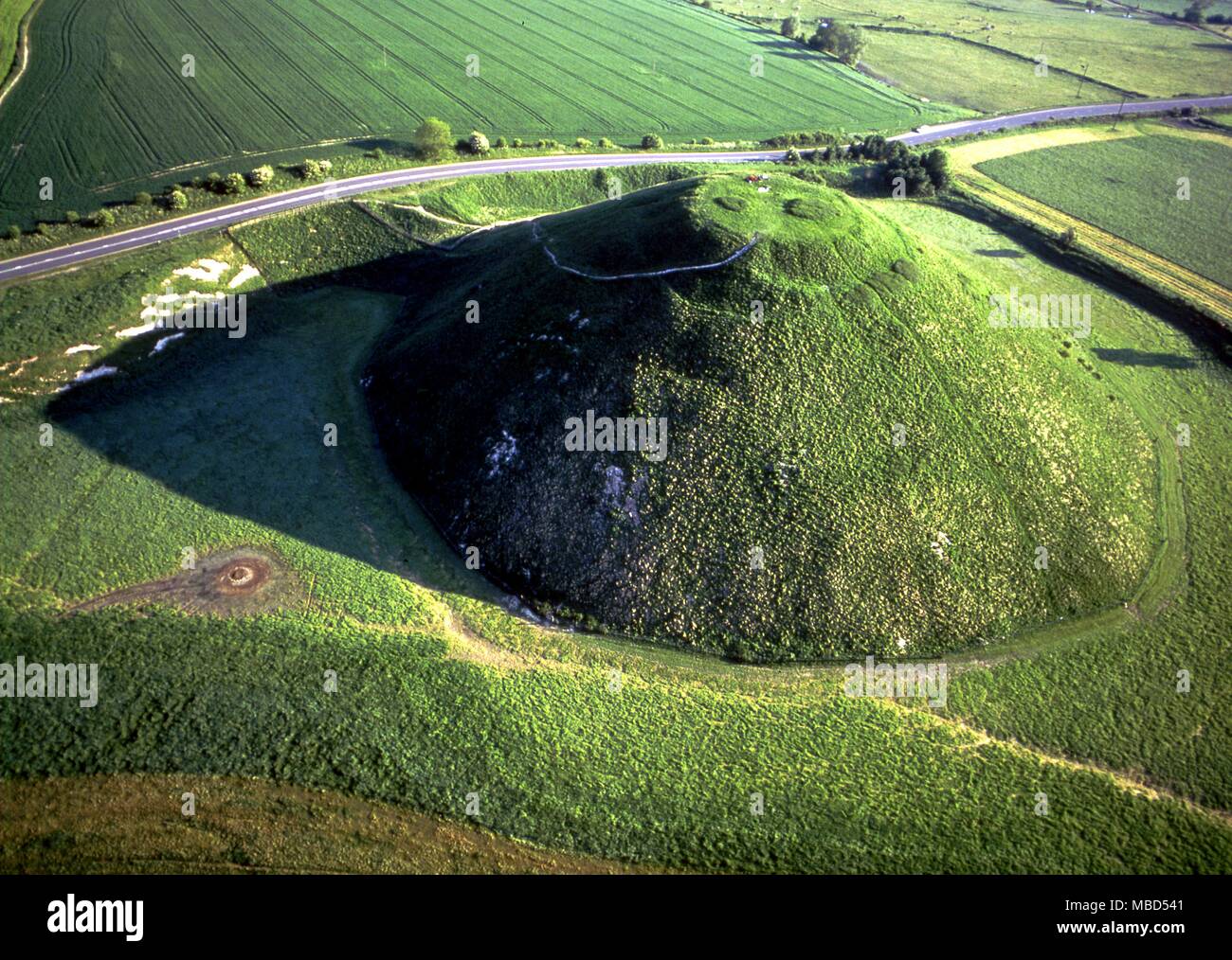 Silbury Hill. This is the largest man made mound in Europe and covers just over 5 acres. Constructed c.2,100 BC and is linked with the nearby Avebury circles. Stock Photo