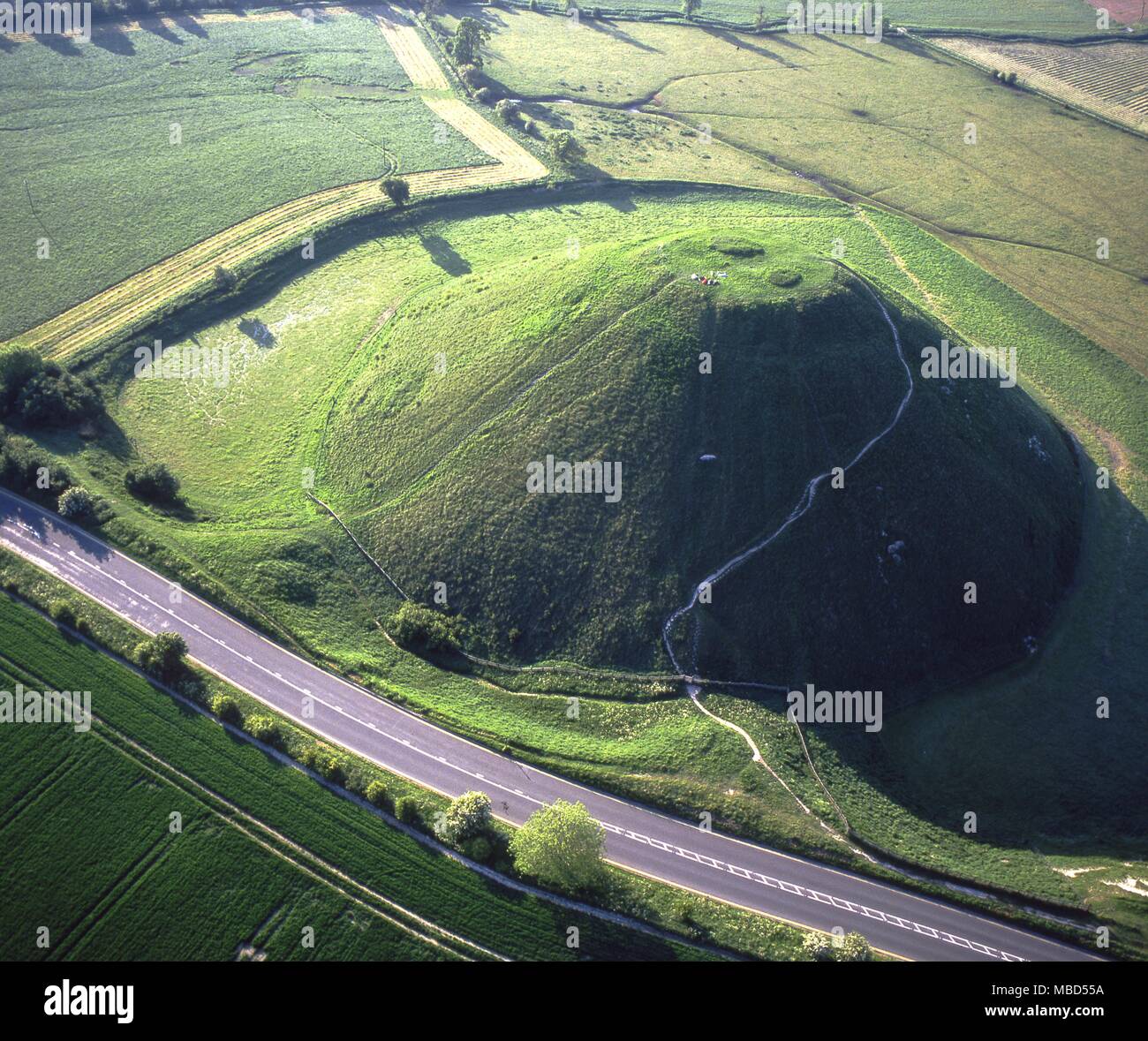 Silbury Hill. This is the largest man made mound in Europe and covers just over 5 acres. Constructed c.2,100 BC and is linked with the nearby Avebury circles. Stock Photo