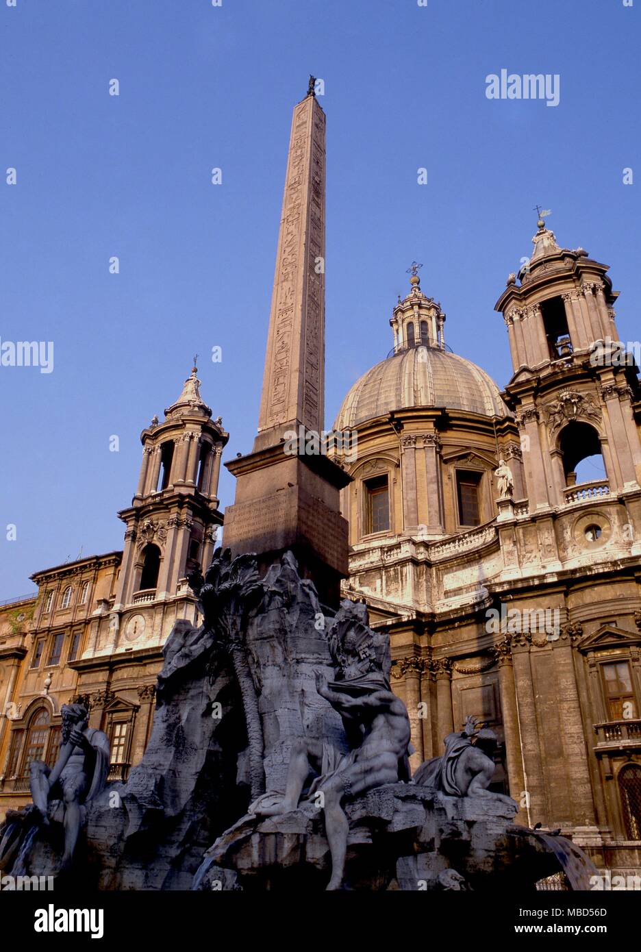 Rome, the Piazza Navona. The church of Sant'Agnese in Agone behind the Fountain of the Four Rivers. Stock Photo