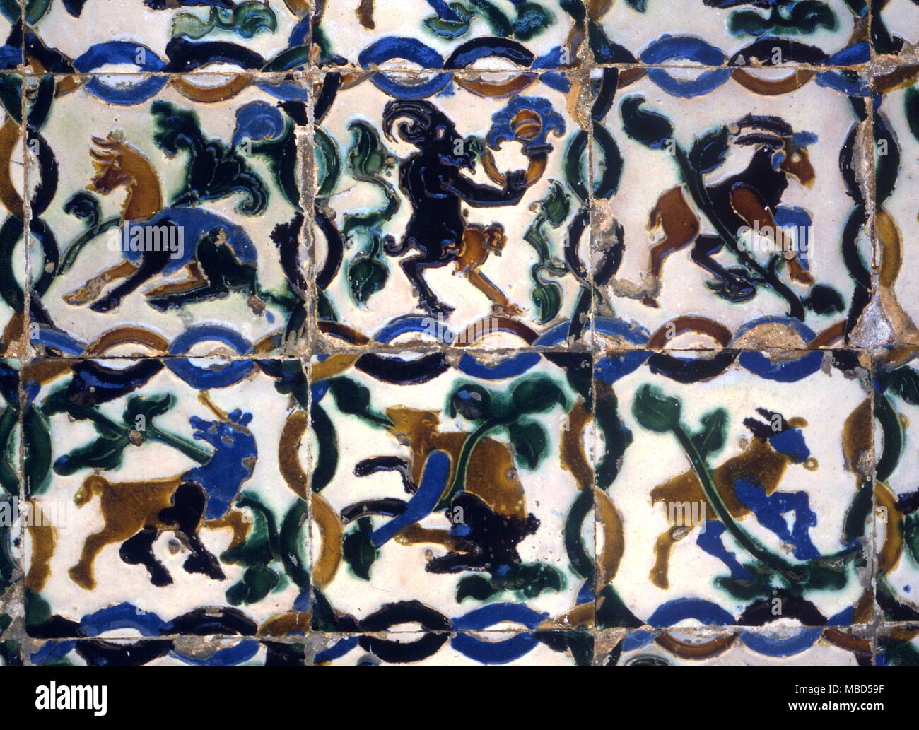 Symbols - Pan etc. Arabian tiles in the Alhambra Palace, Granada. Spain Stock Photo